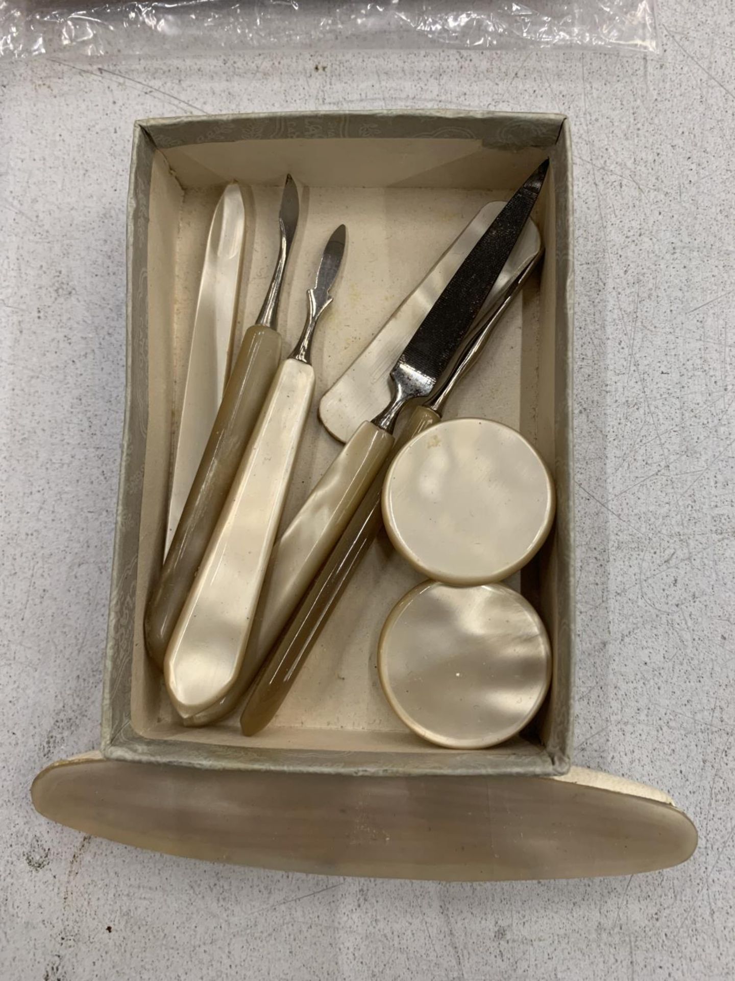 A MOTHER OF PEARL MANICURE SET