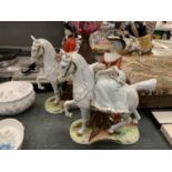TWO CERAMIC FIGURES OF A MAN AND LADY OUT RIDING HEIGHT 21CM