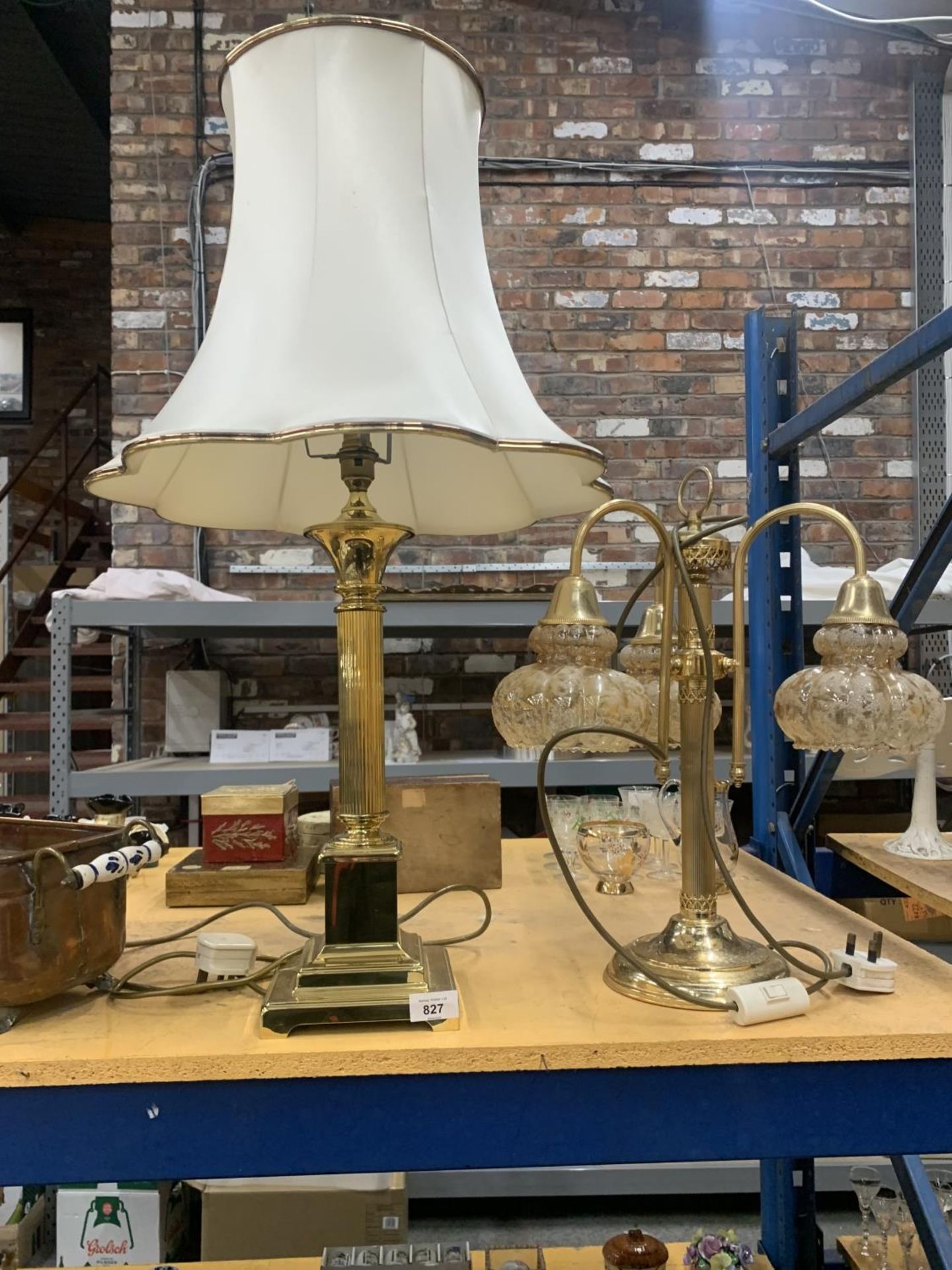 TWO BRASS TABLE LAMPS, ONE WITH A COLUMN STYLE BASE AND THE OTHER WITH THREE BRANCHES AND GLASS