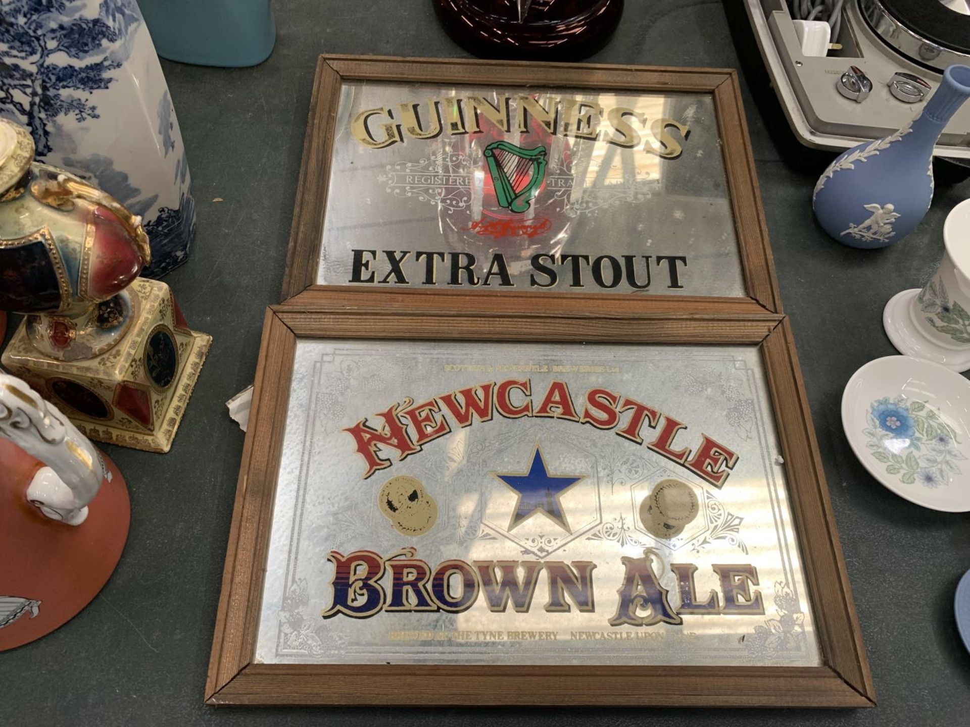 A 'NEWCASTLE BROWN ALE' AND A 'GUINNESS' ADVERTISING MIRROR 33CM X 23CM