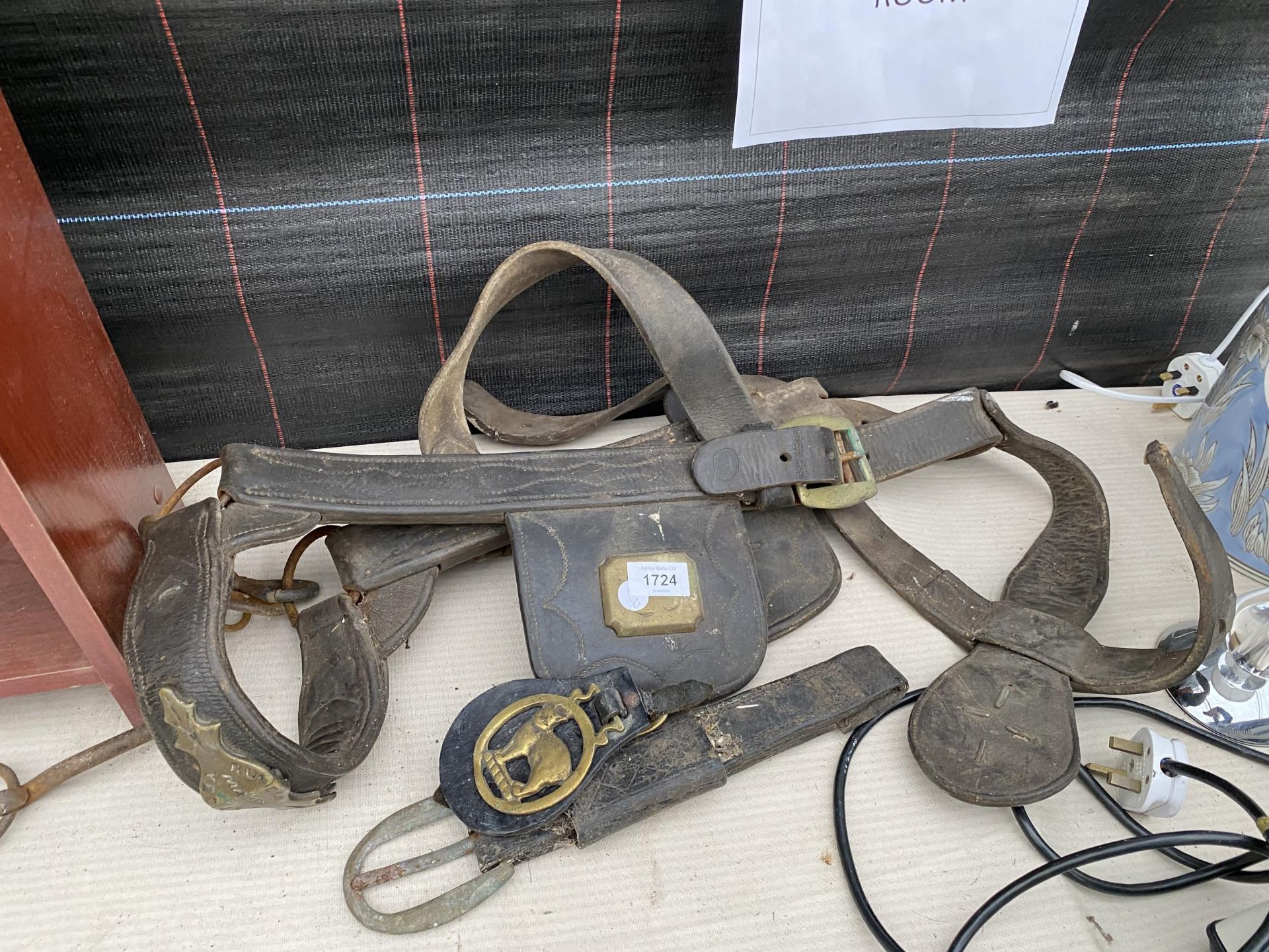 A VINTAGE LEATHER HORSE HARNESS WITH BRASS DETAIL