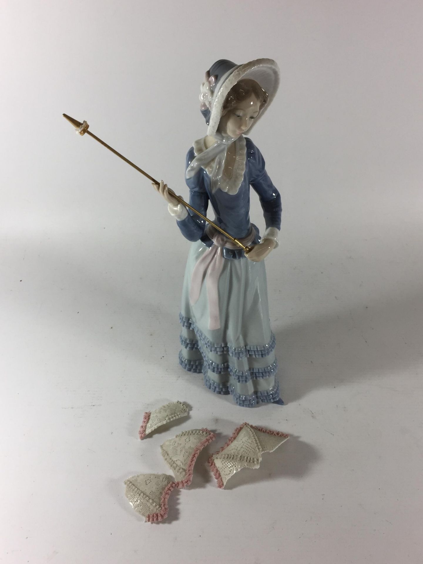 A LLADRO MODEL OF A GIRL WITH PARASOL (PARASOL A/F)