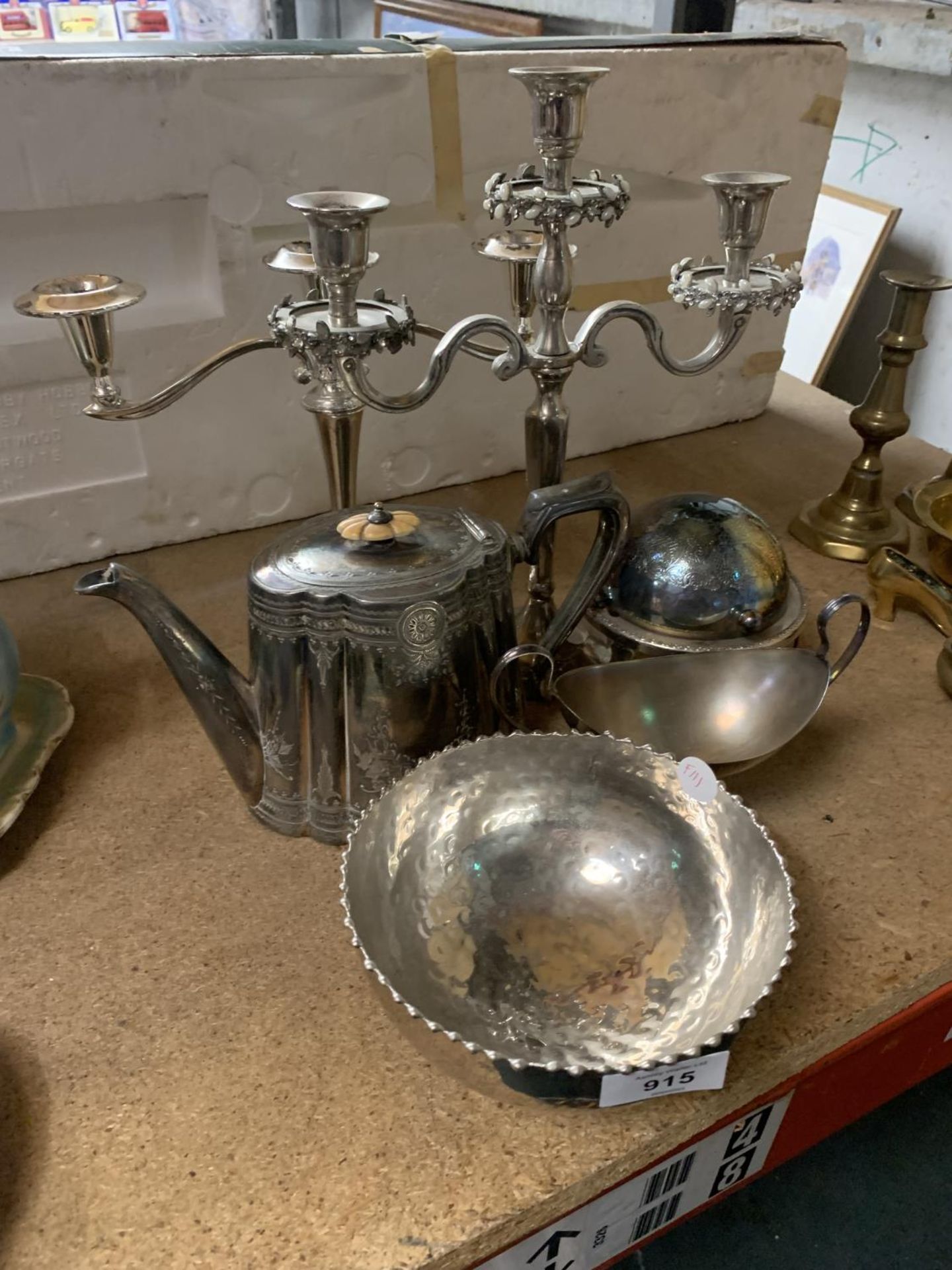 A QUANTITY OF SILVERPLATE TO INCLUDE CANDLEABRA'S, A TEAPOT, BOWLS, ETC