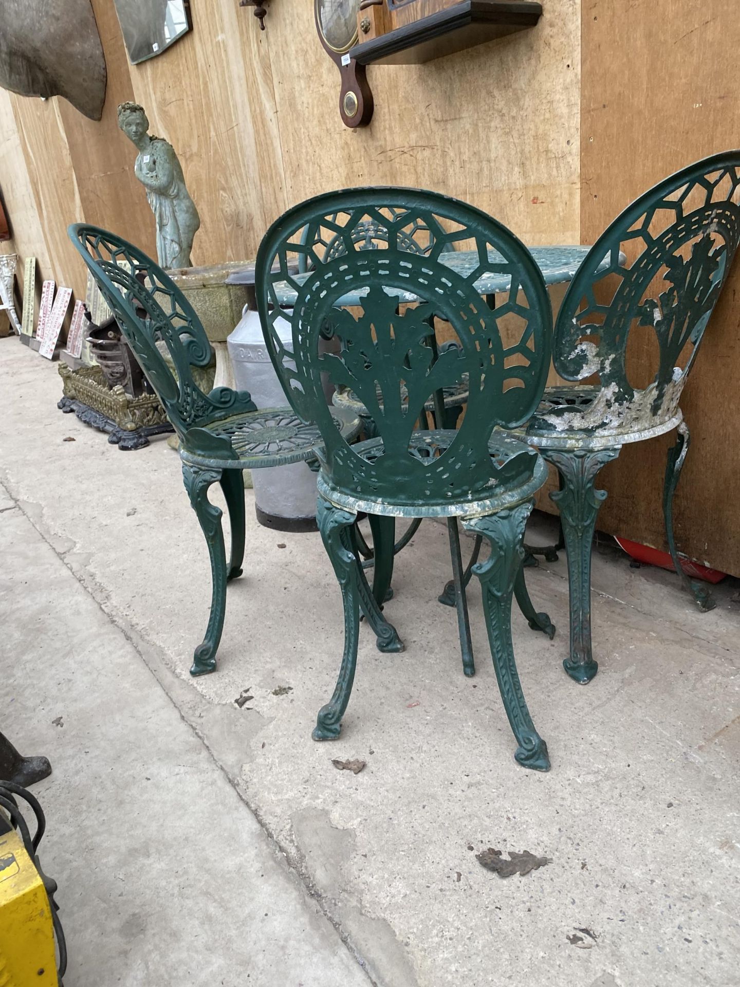 A VINTAGE CAST ALLOY BISTRO SET COMPRISING OF A ROUND TABLE AND FOUR CHAIRS - Image 2 of 2