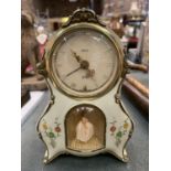 MANTLE CLOCK WITH ALARM IN PALE GREEN WITH FLORAL DECORATION AND A BALLERINA FIGURE HEIGHT 15CM