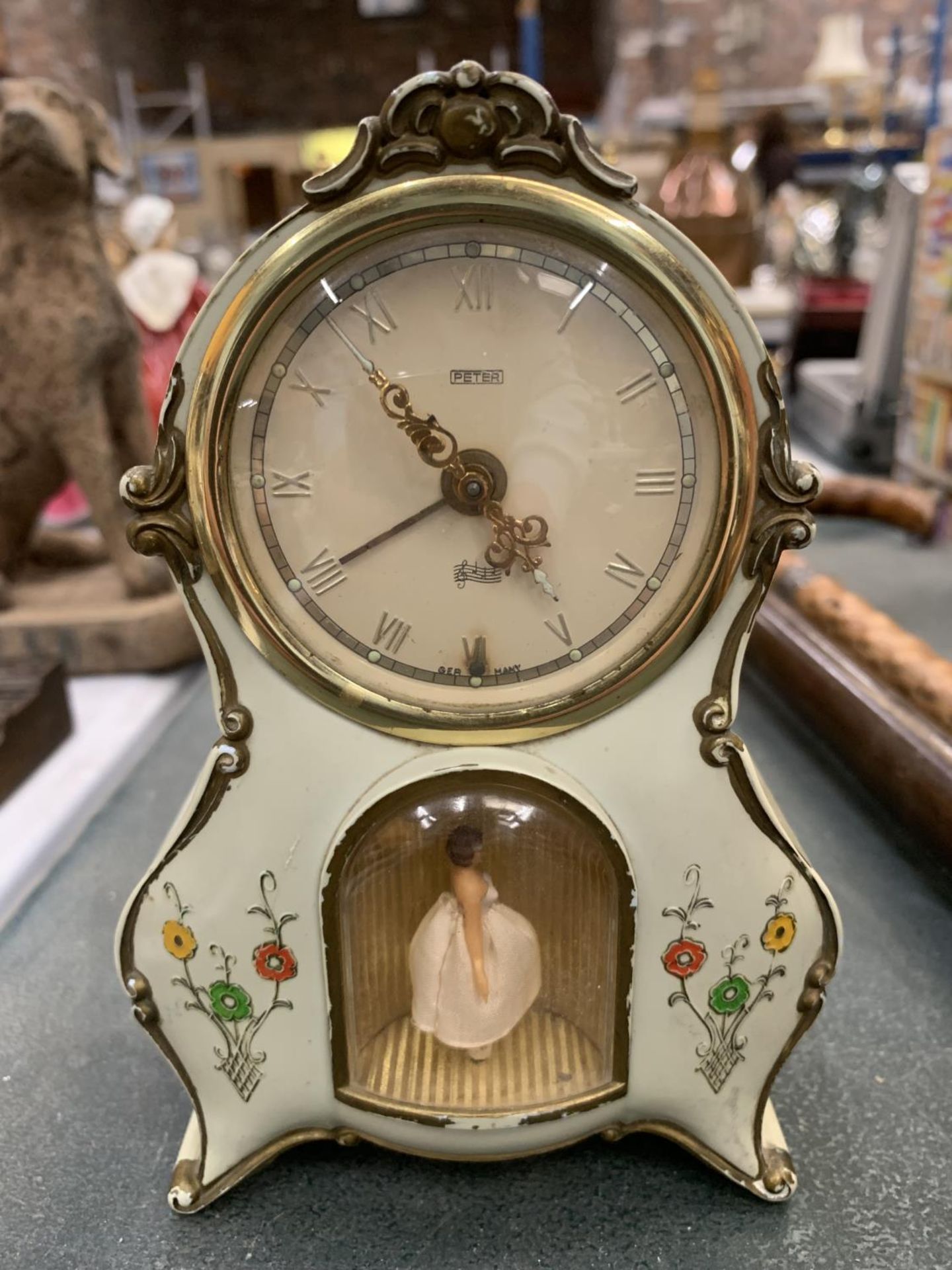 MANTLE CLOCK WITH ALARM IN PALE GREEN WITH FLORAL DECORATION AND A BALLERINA FIGURE HEIGHT 15CM