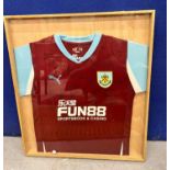 A FRAMED BURNLEY FOOTBALL SHIRT SIGNED BY PLAYERS
