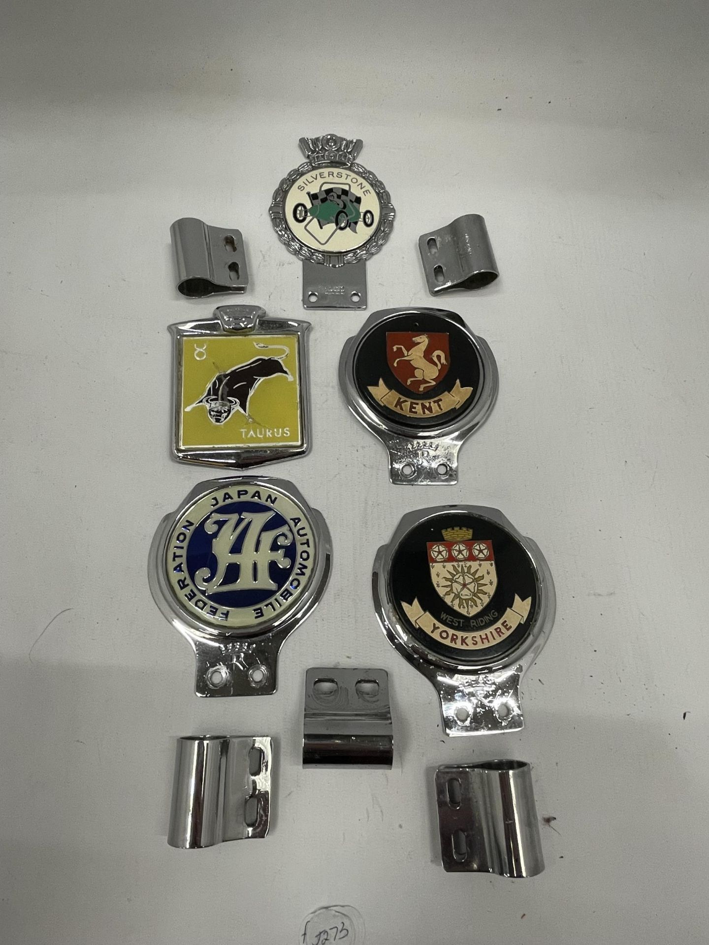 A COLLECTION OF FIVE VINTAGE CAR BADGES, YORKSHIRE, SILVERSTONE ETC