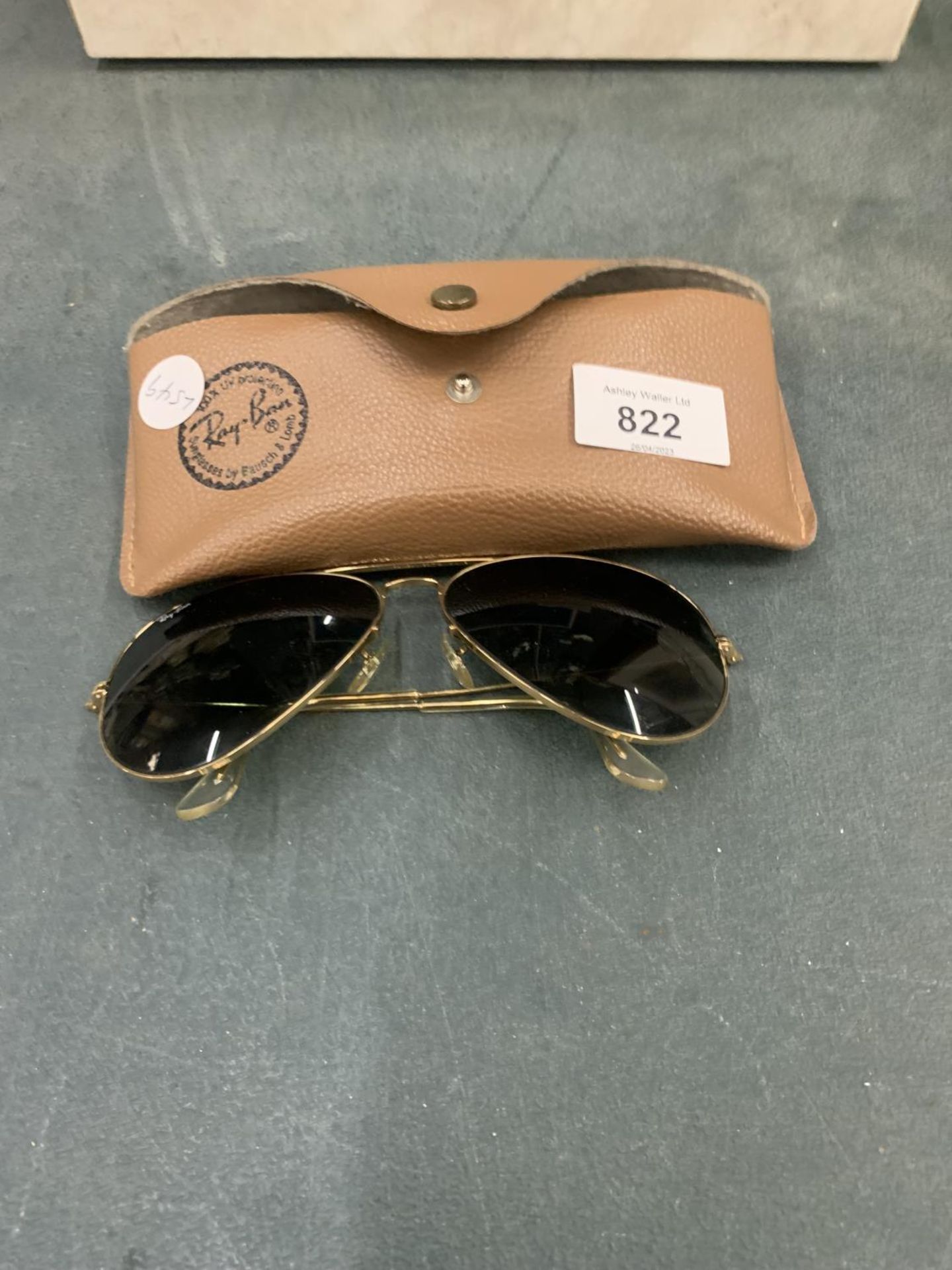 A PAIR OF SUNGLASSES MARKED 'RAY-BAN' IN A CASE