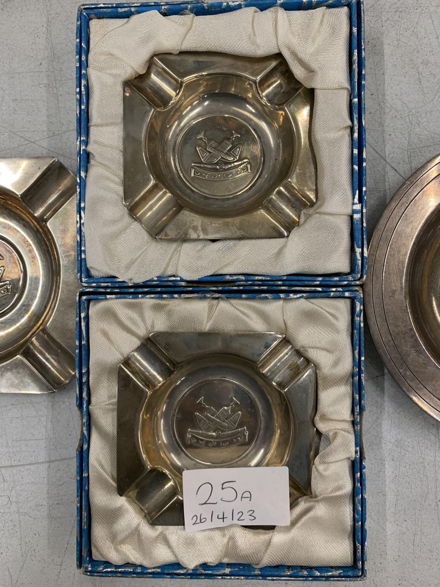 THREE SILVER PLUS ONE WHITE METAL ASHTRAYS WITH MILITARY EMBLEMS - Image 3 of 7