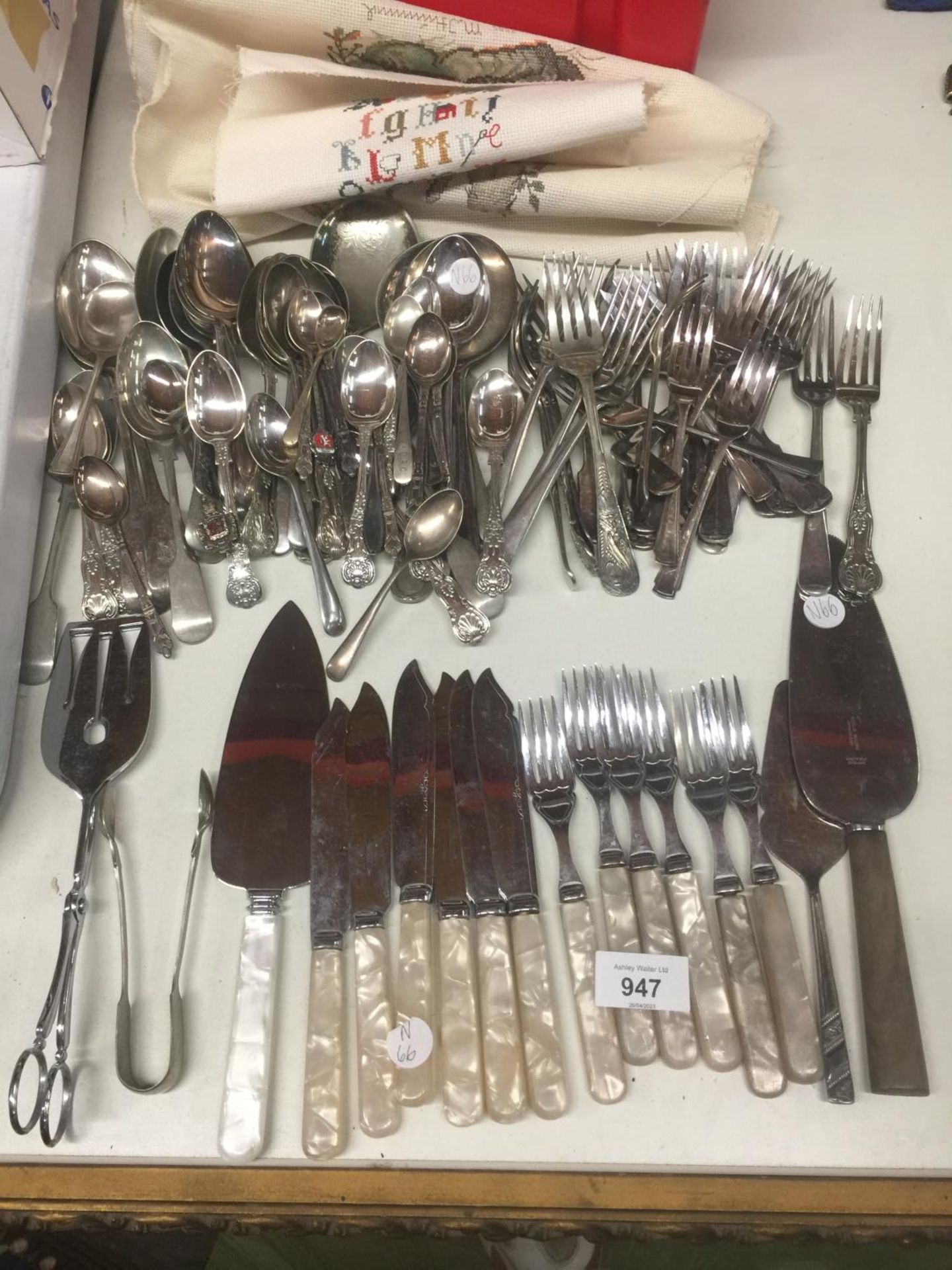 A LARGE AMOUNT OF FLATWARE TO INCLUDE KNIVES, FORKS, SPOONS, SERVERS, ETC