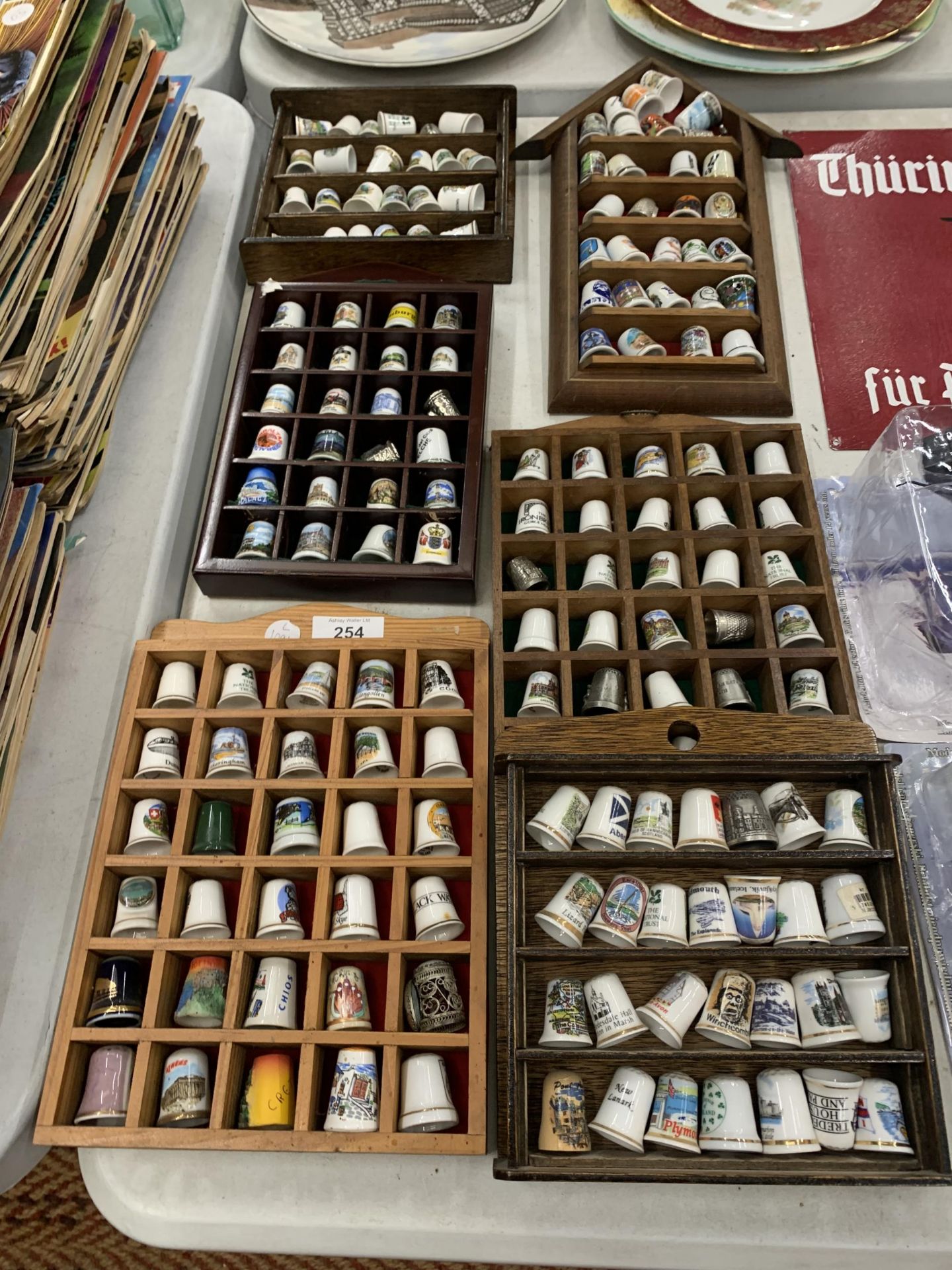 SIX WOODEN DISPLAYS OF CERAMIC THIMBLES