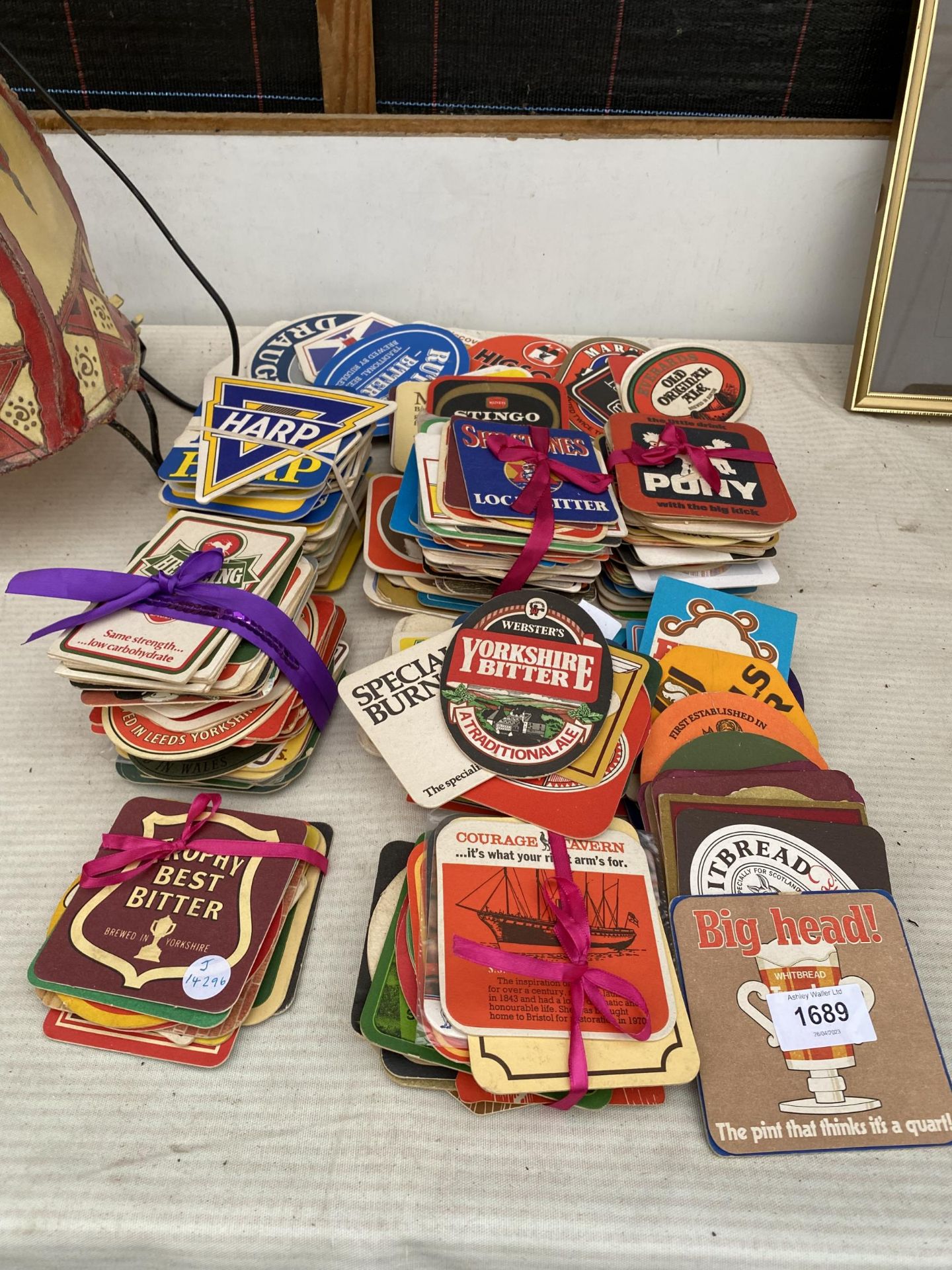 A LARGE ASSORTMENT OF BEER MATS