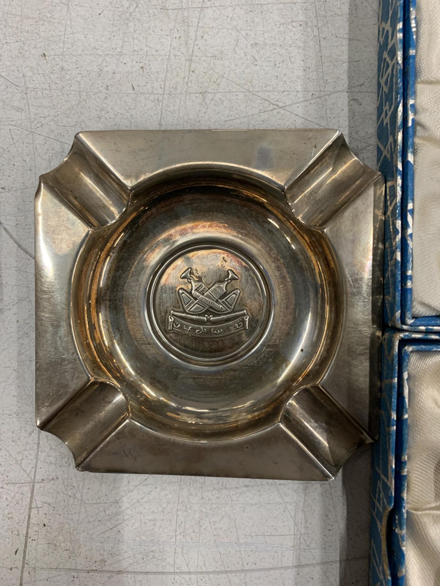 THREE SILVER PLUS ONE WHITE METAL ASHTRAYS WITH MILITARY EMBLEMS - Image 2 of 7