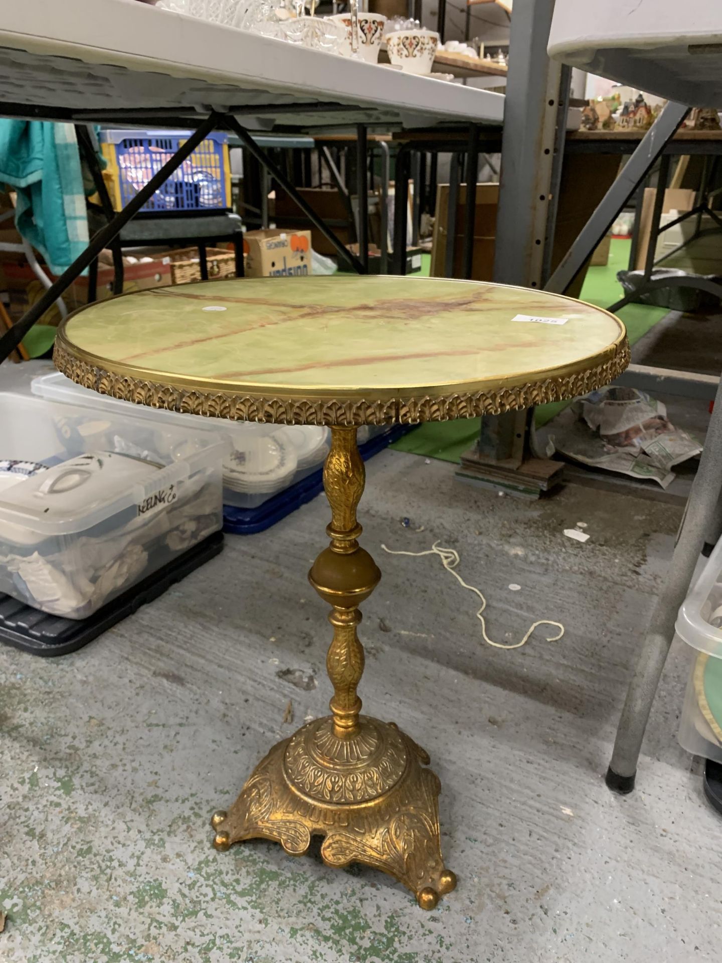 AN ONXY TOP GILT FRAMED LOW TABLE