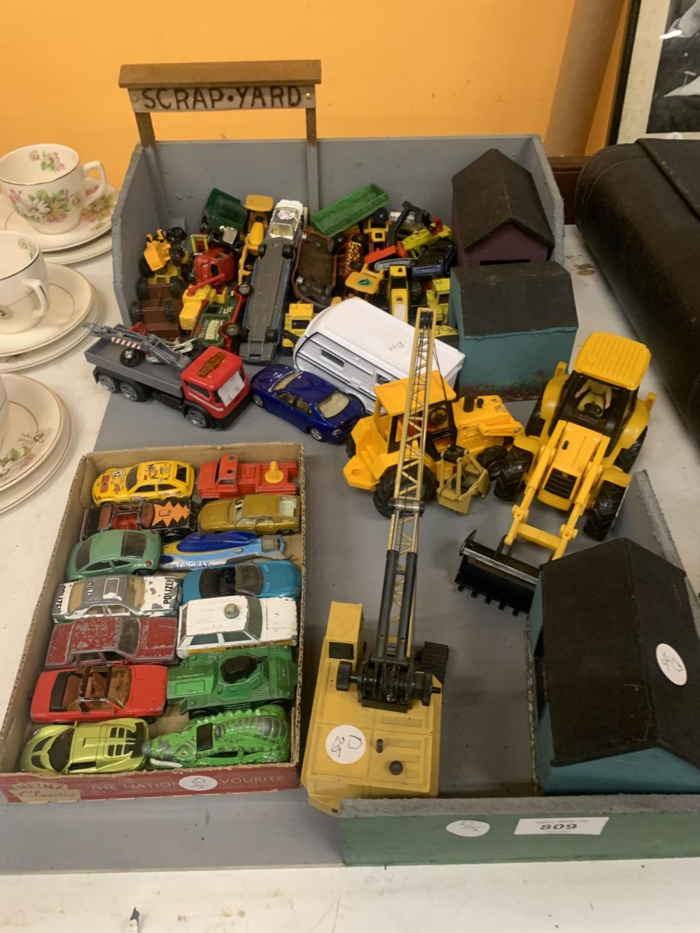 A TOY SCRAP YARD WITH A LARGE QUANTITY OF DIE-CAST VEHICLES