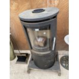 A LARGE CAST IRON CURVED LOG BURNER