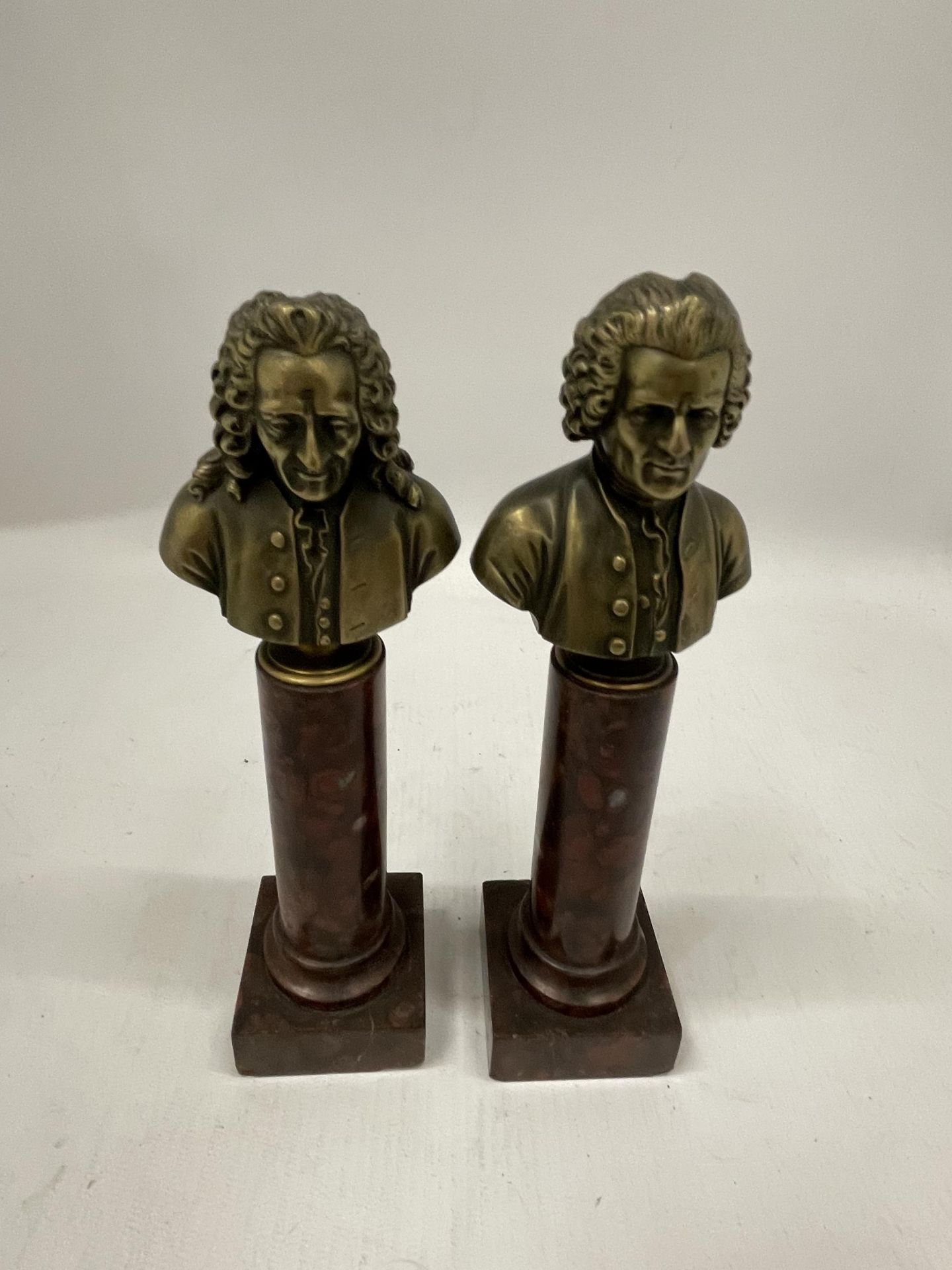 A PAIR OF FRENCH BRONZE BUSTS OF MOLIERE (1639 - 1699) AND ROUSSEAU (1712 -1778) EACH ON A SOCLE AND