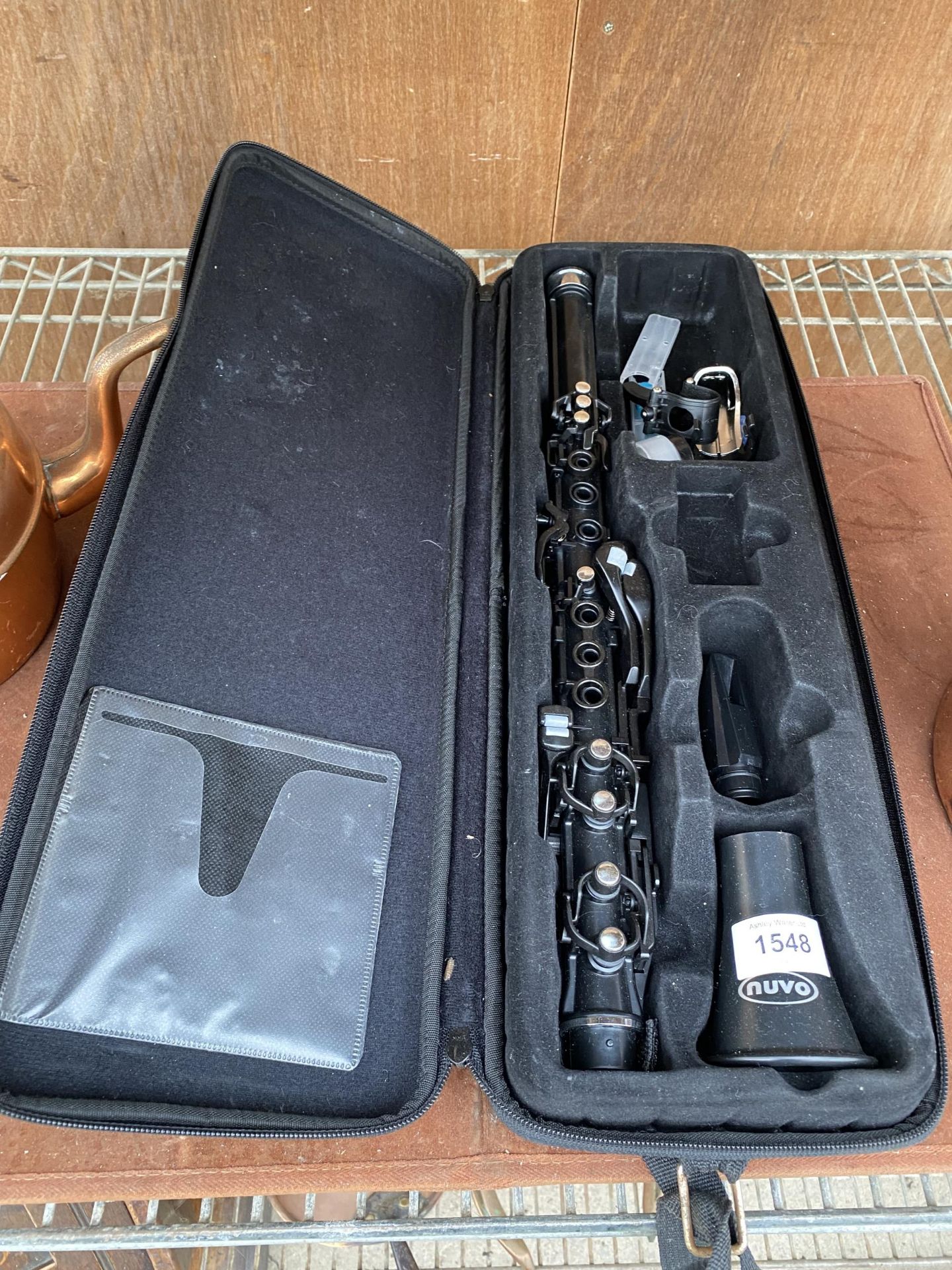 A PLASTIC NUVO CLARINET WITH CARRY CASE
