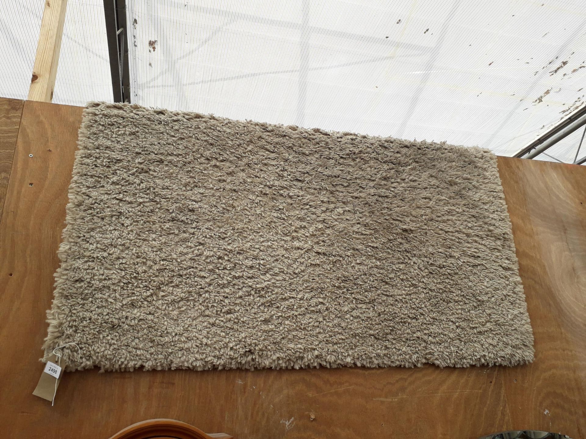 A MODERN CREAM RUG