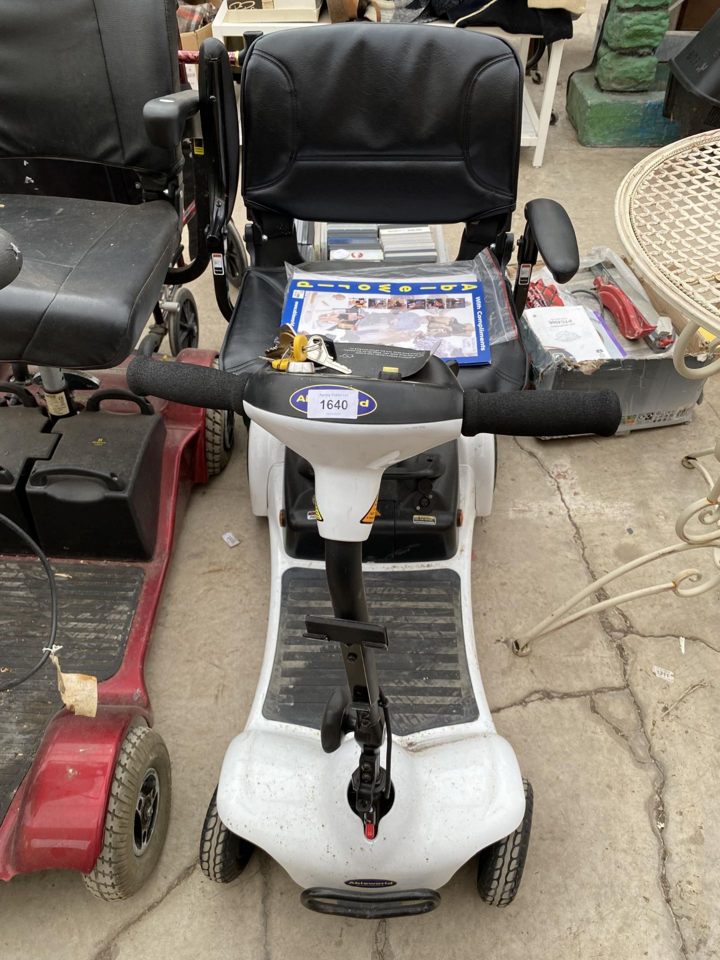 AN ABLEWORLD MOBILITY SCOOTER COMPLETE WITH KEY