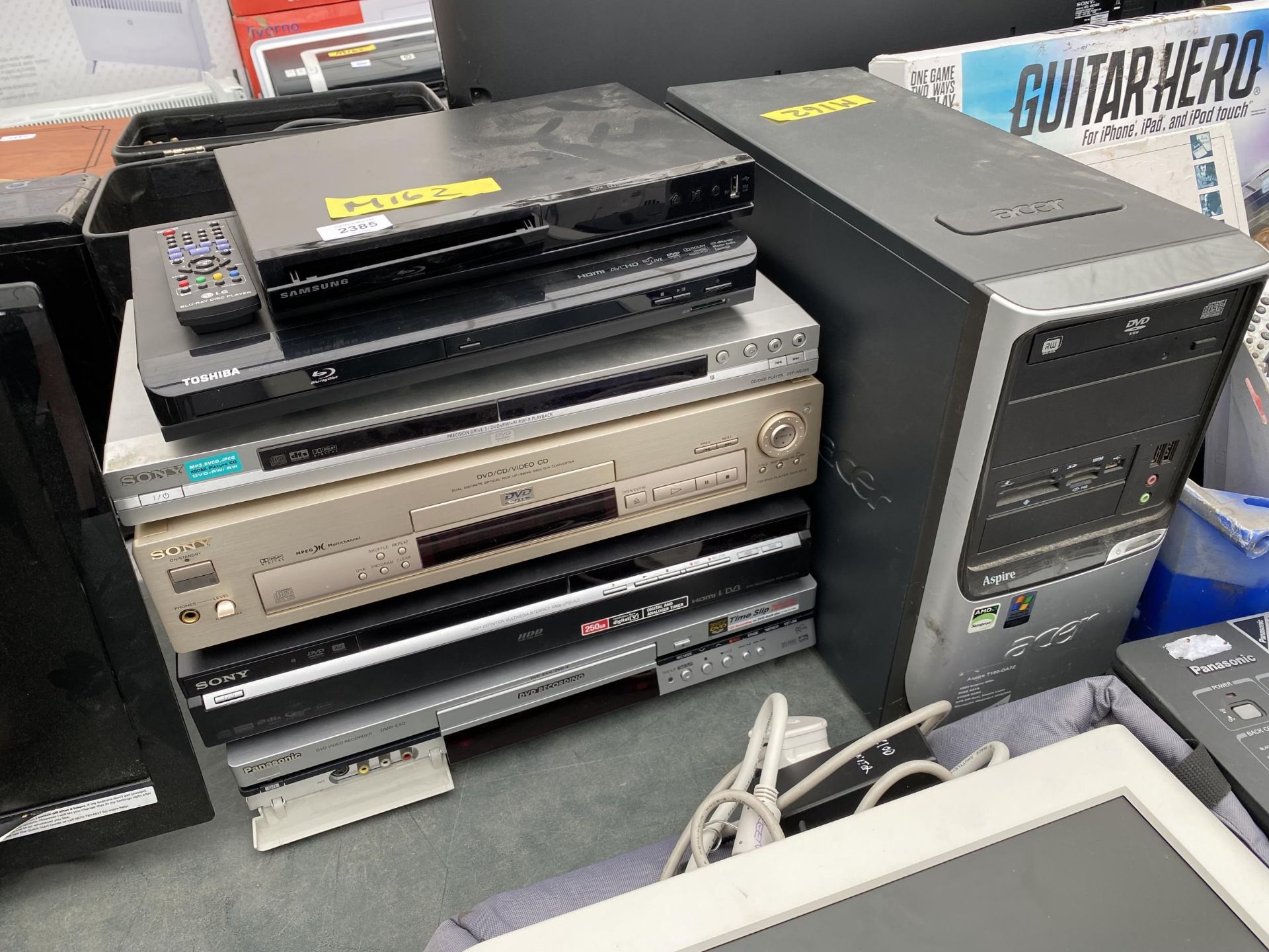 AN ASSORTMENT OF ITEMS TO INCLUDE AN ACER COMPUTER TOWER, A SONY DVD PLAYER AND A TOSHIBA BLU-RAY