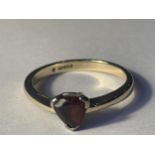 A 9 CARAT GOLD RING WITH A HEART SHAPED RUBY GROSS WEIGHT 3.27 GRAMS SIZE Q/R
