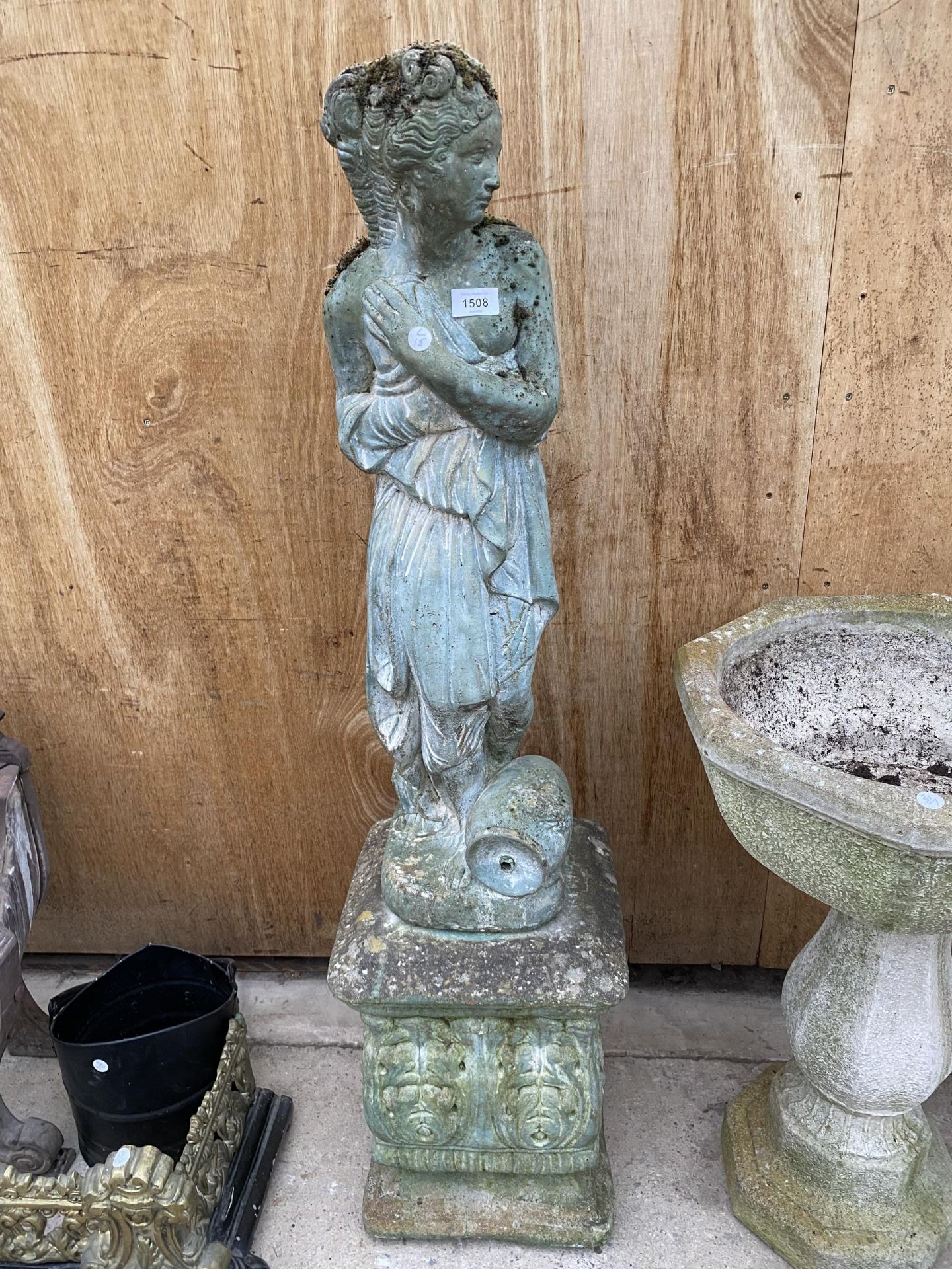 A RECONSTITUTED STONE FEMALE FIGURE ON A PEDESTAL BASE (H:122CM)