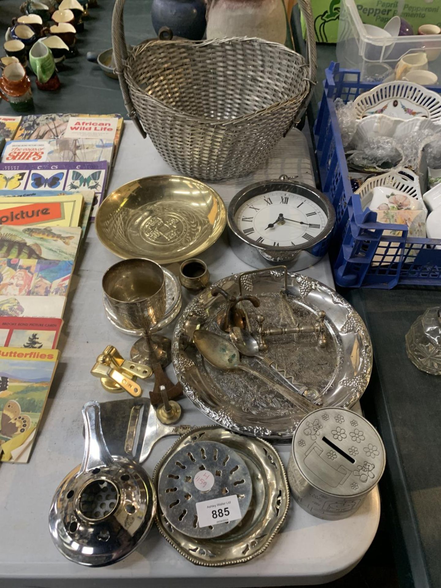 A QUANTITY OF SILVER PLATED ITEMS TO INCLUDE PLATES, A WALL CLOCK, A GOBLET, MONEY BOX, BASKET, ETC