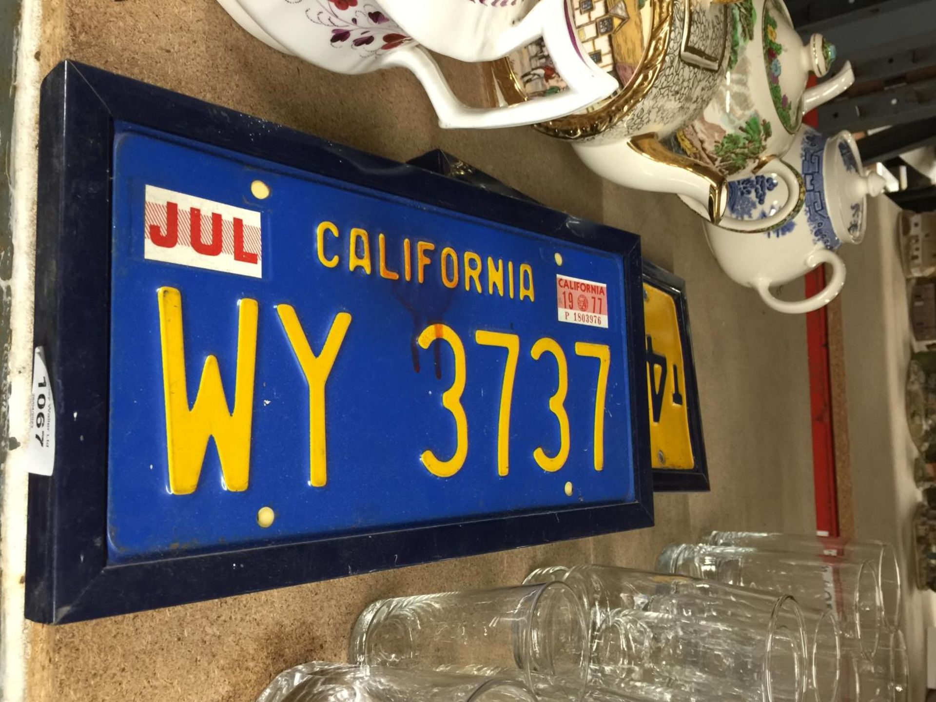 TWO VINTAGE AMERICAN CAR REGISTRATION PLATES - CALIFORNIA AND OREGON - IN FRAMES