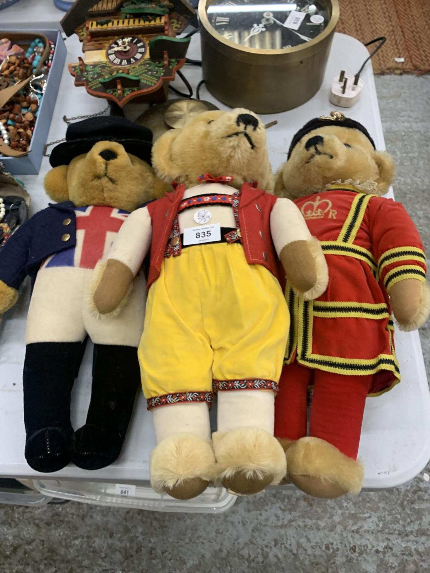 THREE VINTAGE MERRYTHOUGHT TEDDY BEARS, TWO IN ROYAL REGALIA, ALL WITH THE MERRYTHOUGHT LABEL