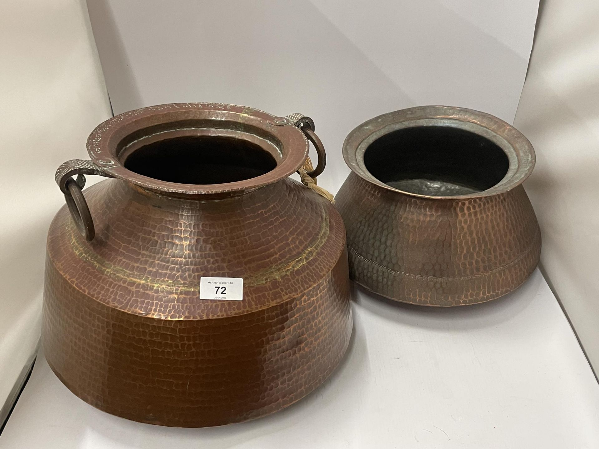 TWO VINTAGE MIDDLE EASTERN COOKING POTS - ONE WITH LOOP HANDLES
