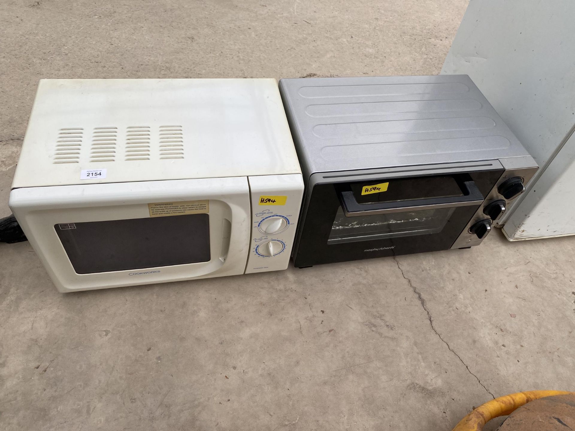 A MICROWAVE OVEN AND A COUNTERTOP GRILL