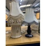 TWO TABLE LAMPS WITH SHADES, ONE A MOTTLED BLUE COLOUR, THE OTHER FLORAL PATTERNED