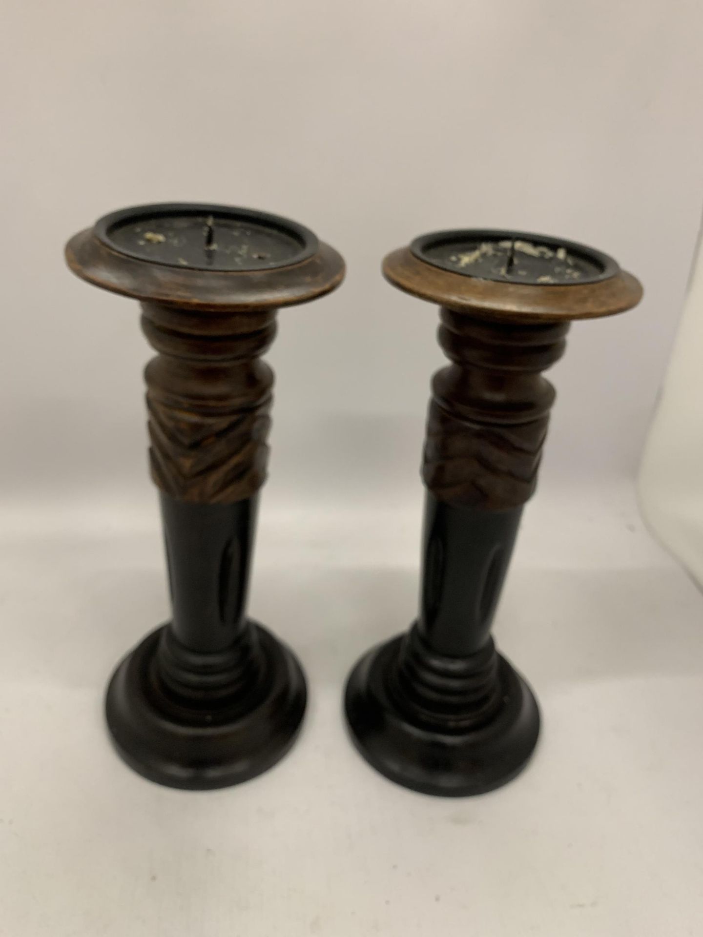 A PAIR OF VINTAGE WOODEN CANDLESTICKS