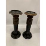 A PAIR OF VINTAGE WOODEN CANDLESTICKS