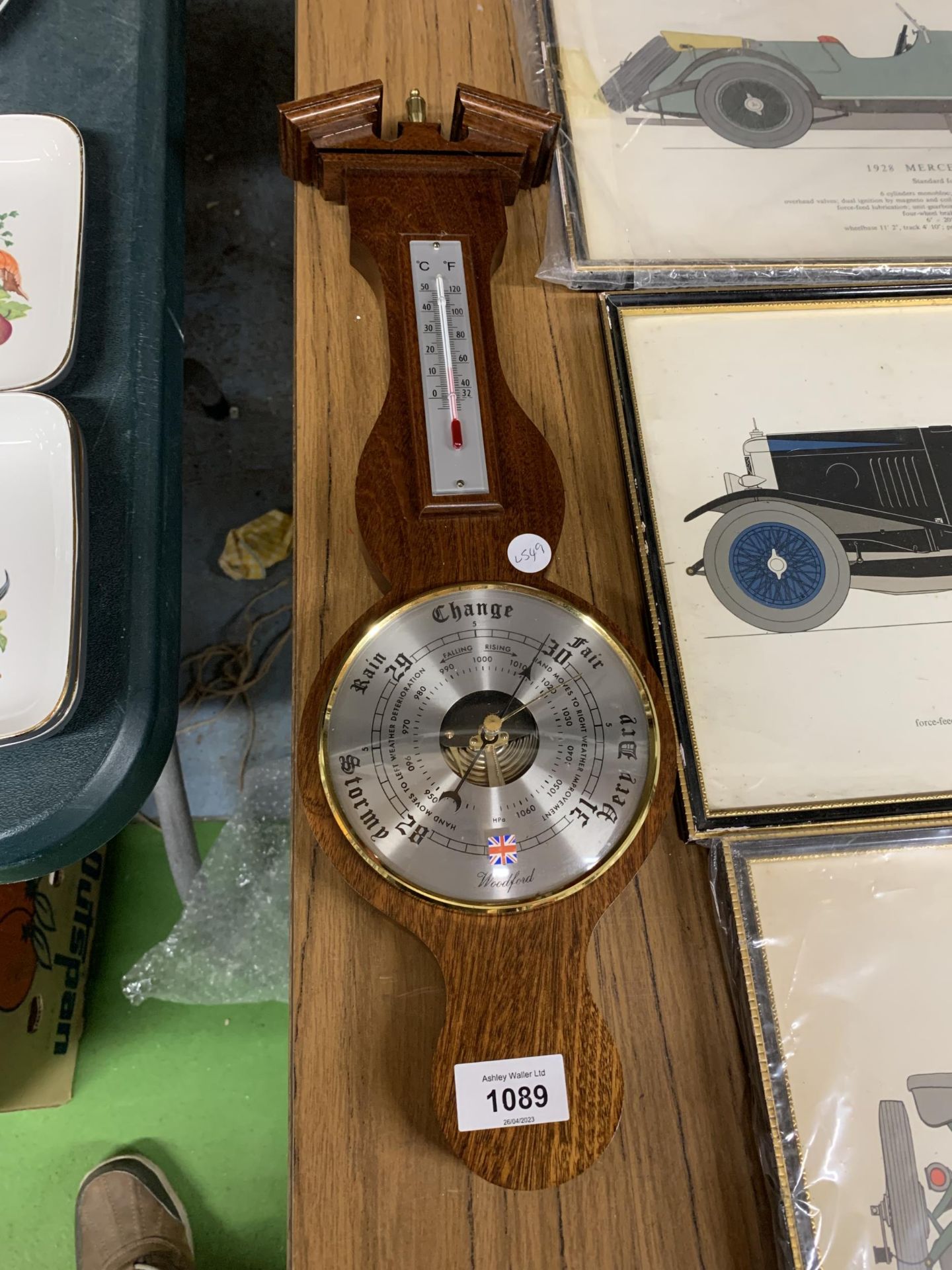 A WOODEN CASED BAROMETER