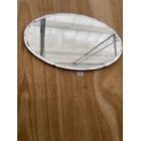 AN OVAL ART DECO UNFRAMED BEVELED EDGE WALL MIRROR WITH HANGING CHAIN