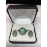 A SILVER RING AND EARRING SET WITH NAVAJO STYLE STONES IN A PRESENTATION BOX