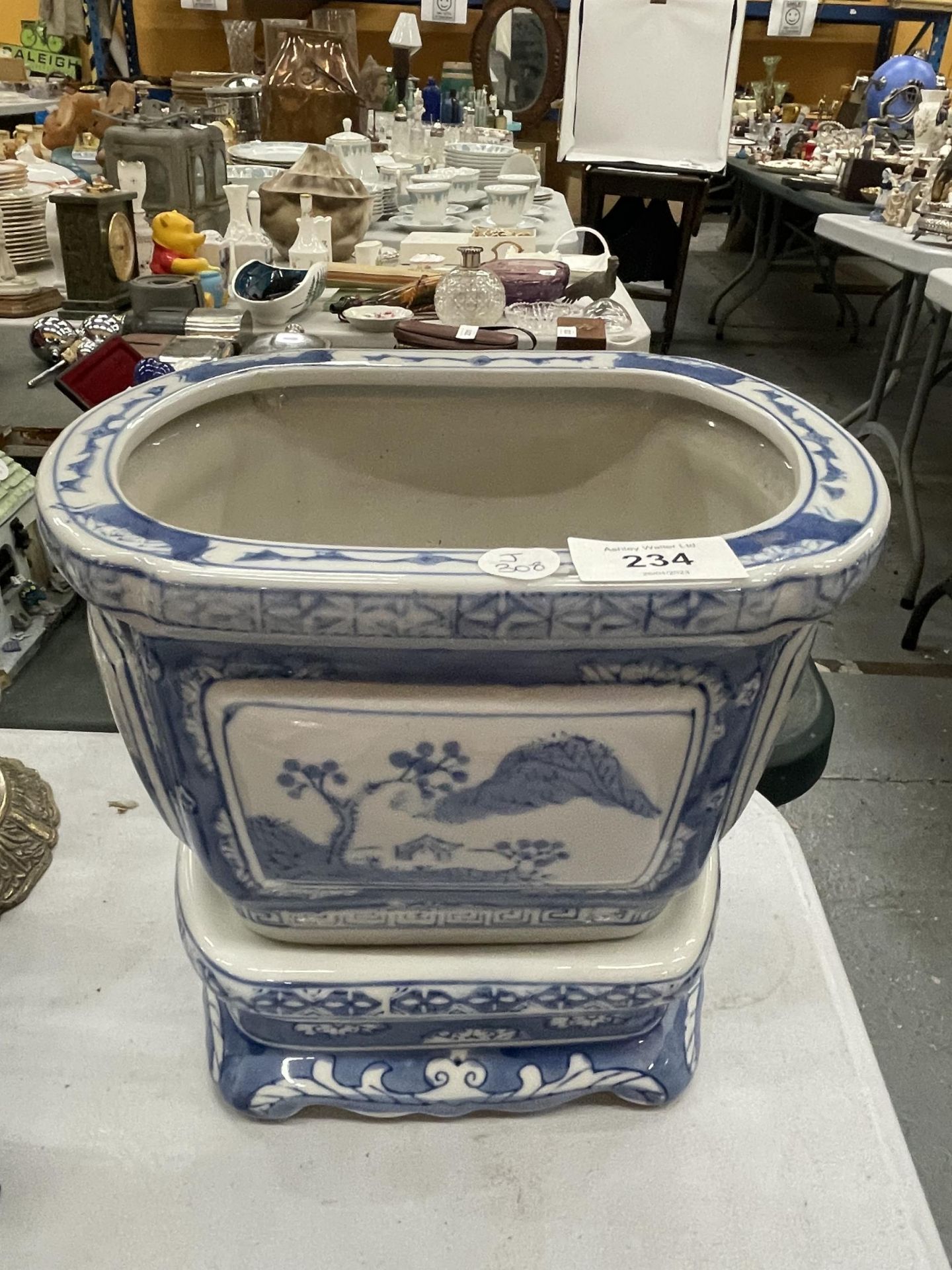 A MODERN CHINESE BLUE AND WHITE PLANTER ON STAND