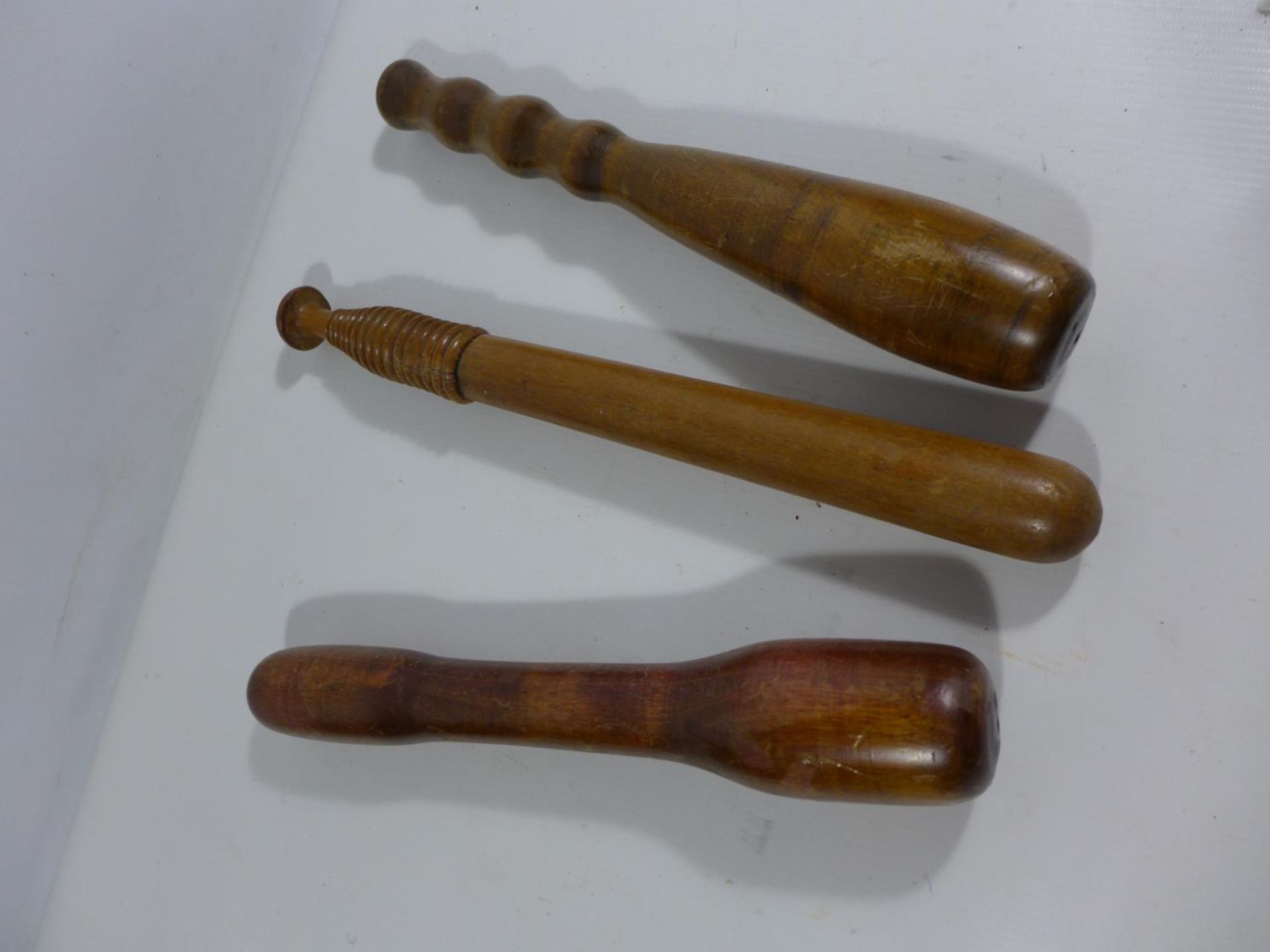 THREE ASSORTED WOODEN CLUBS, LENGTHS 29CM AD 32.5CM - Image 3 of 3