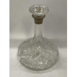 A CUT GLASS SHIPS DECANTER WITH HALLMARKED SILVER COLLAR