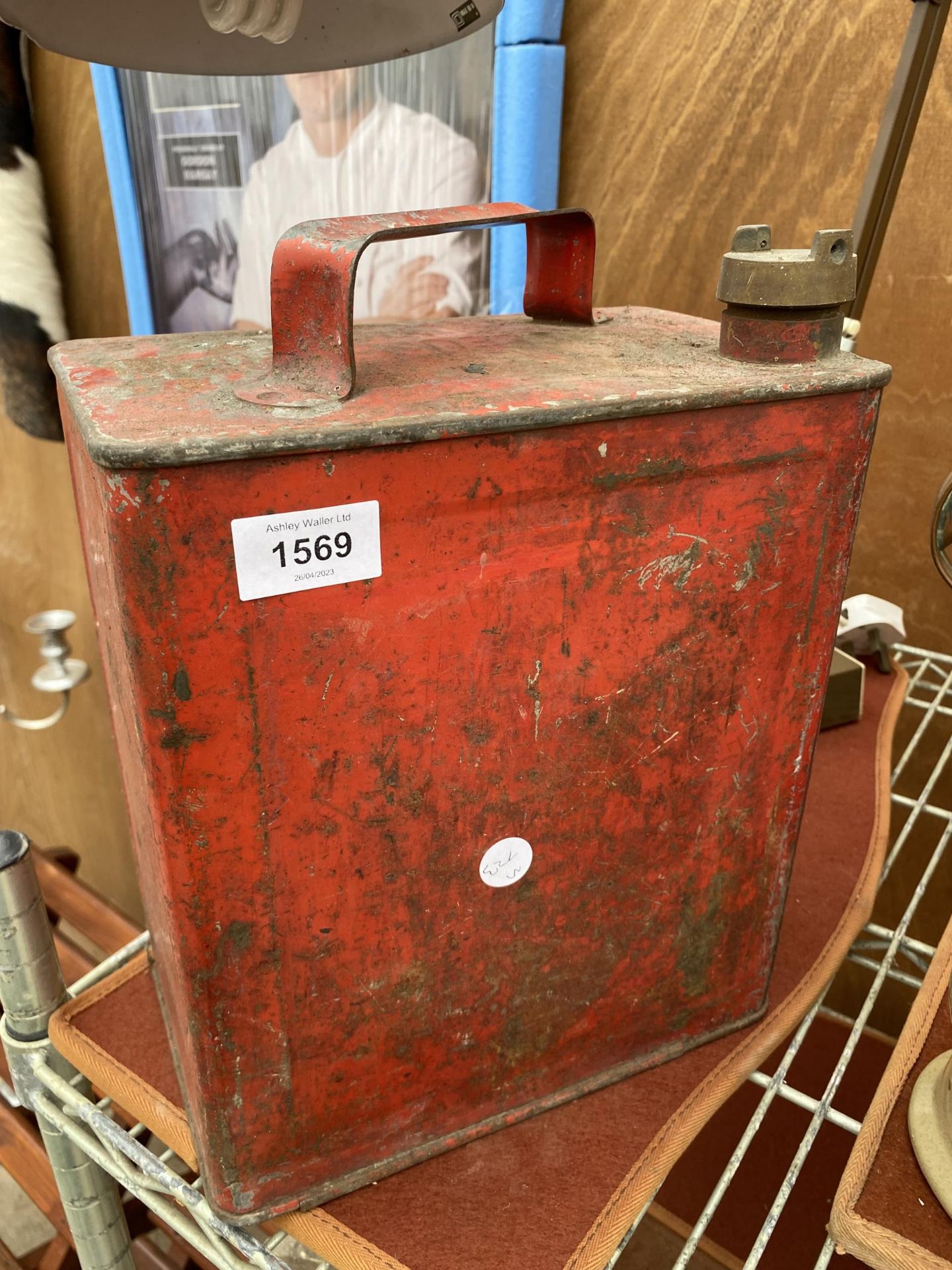 A VINTAGE FUEL CAN WITH BRASS CAP