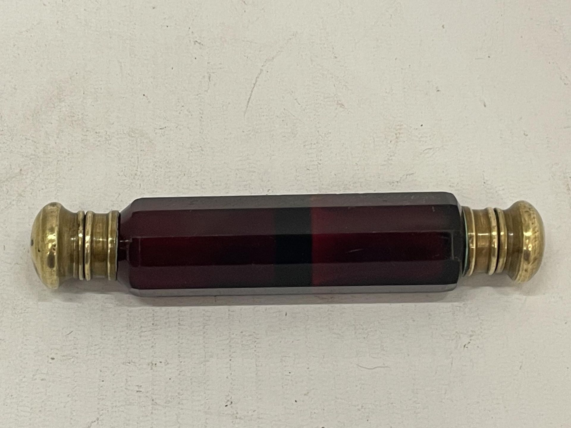 A VICTORIAN RED GLASS DOUBLE SIDED PERFUME BOTTLE
