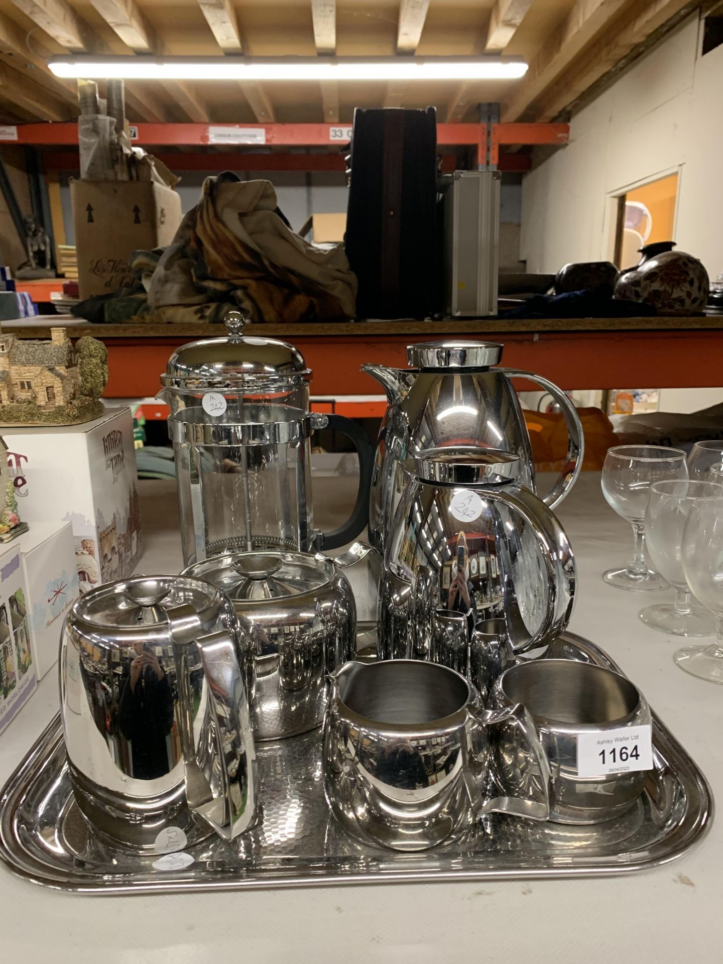 AN OLD HALL STAINLESS STELL TEASET TO INCLUDE A TRAY, TEA AND COFFEE POT, HOT WATER POT, SUGAR
