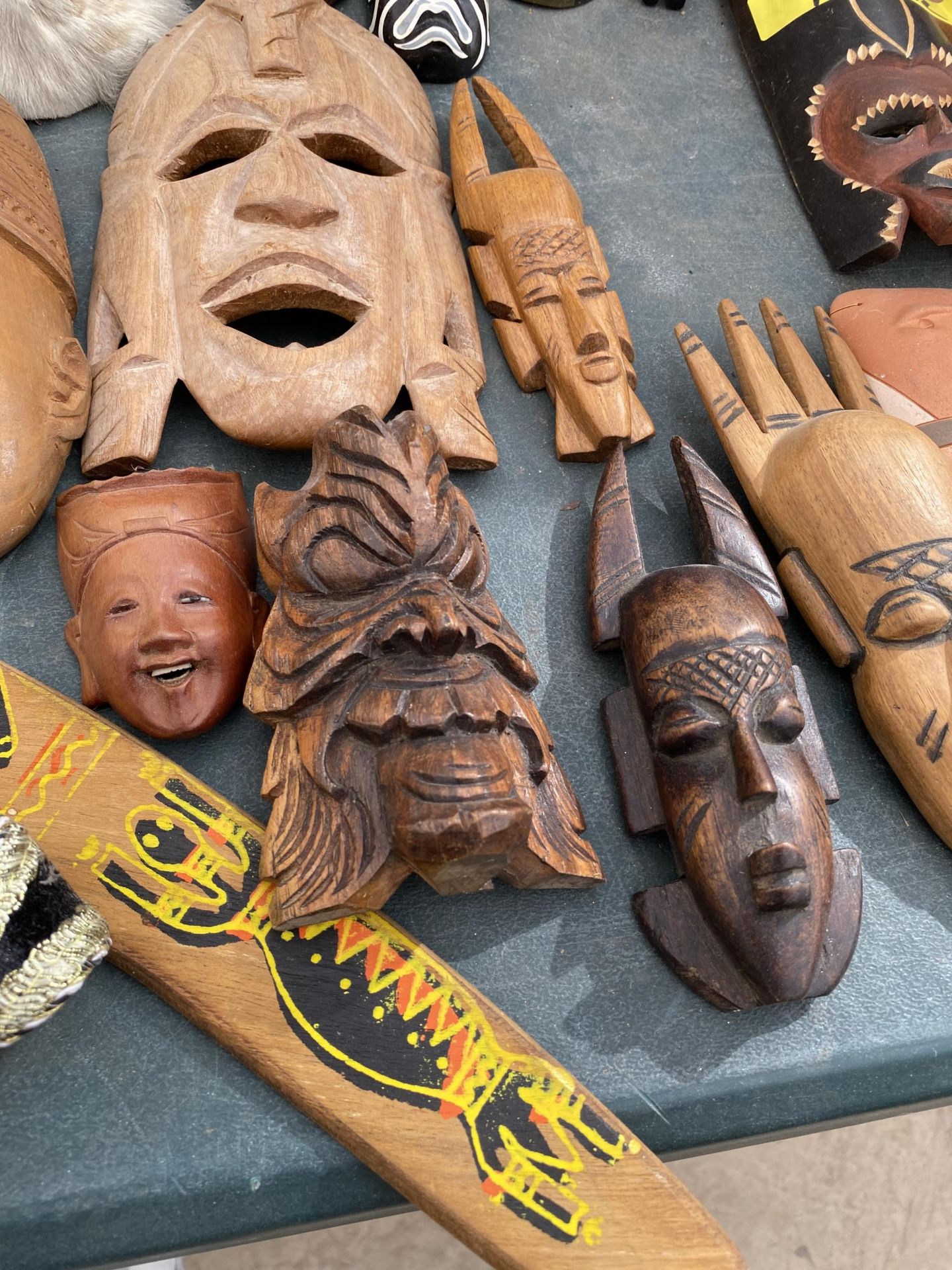A LARGE QUANTITY OF TREEN CARVED TRIBAL MASKS - Image 3 of 3