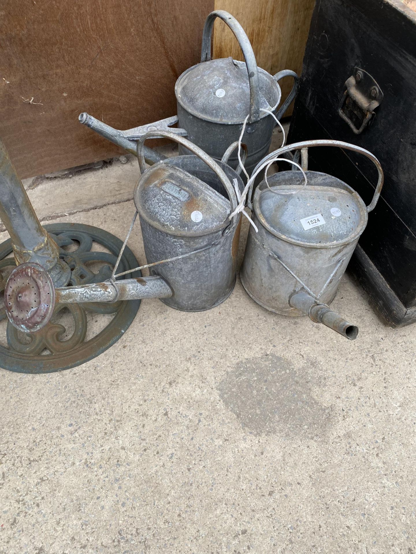 THREE VARIOUS GALVANISED WATERING CANS