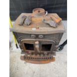 A LARGE DECORATIVE CAST IRON LOG BURNER