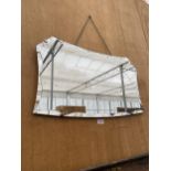 AN ART DECO UNFRAMED BEVELED EDGE SIX SIDED WALL MIRROR WITH HANGING CHAIN