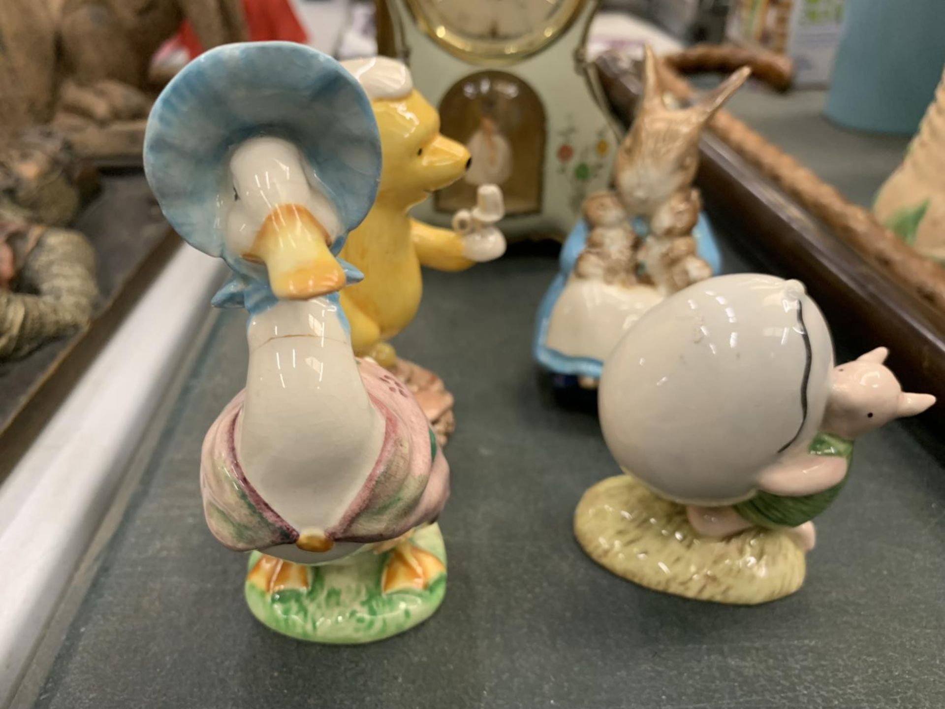 A COLLECTION OF ROYAL DOULTON FIGURES TO INCLUDE WINNIE-THE-POOH, PIGLET, PLUS AND AN UNMARKED